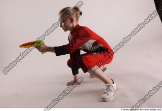 DENISA SITTING POSE WITH GUN